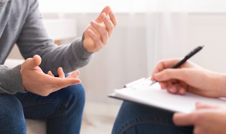 PsychotherapistWritingNotesAssessingPatientsHealthAndGivingDiagnosisTo Identity Consultancy IC Identity Consultancy IC